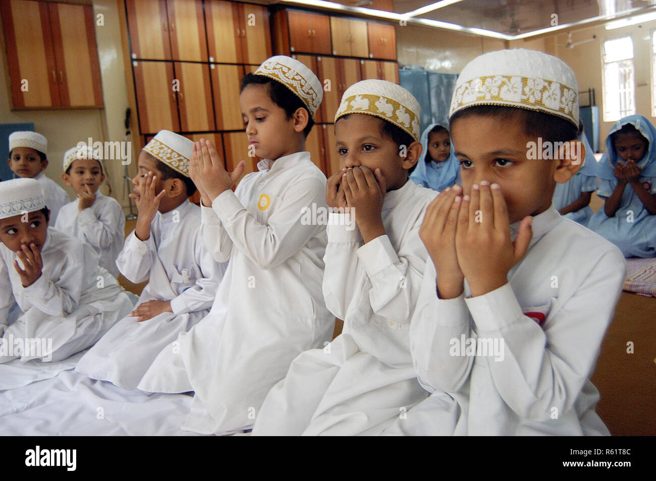 School children praying Namaz before their classes at a School at ...