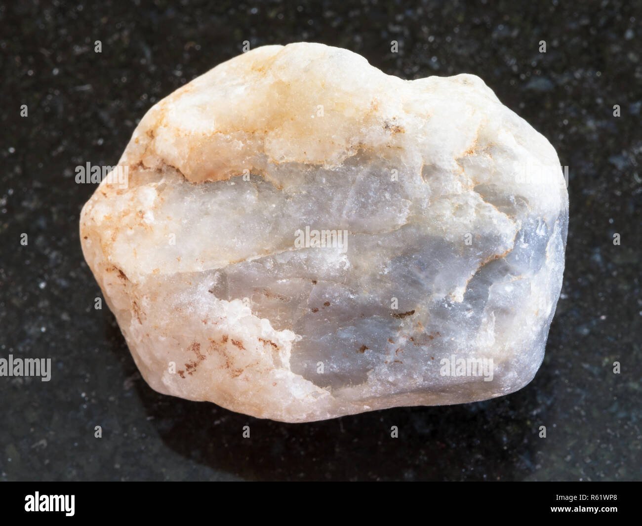 rough marble stone on dark granite background Stock Photo Alamy