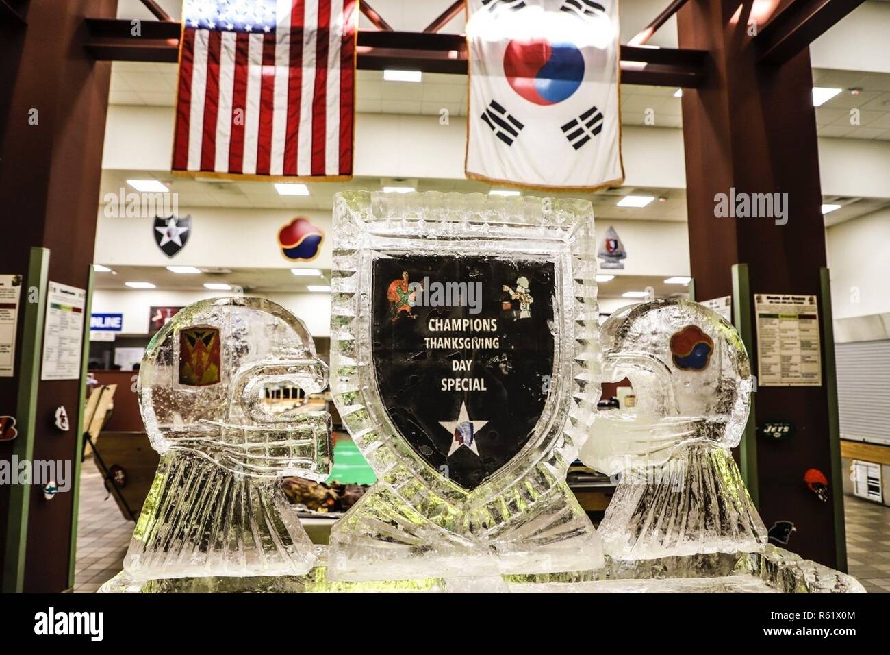 CAMP CARROLL, Republic of Korea - The Champion Cafe displays a unique, football-themed ice sculpture for their Thanksgiving meal to give Soldiers a taste of home, build morale and esprit de corps Nov. 22. Each dining facility created a unique display to create a welcoming, festive environment. Stock Photo
