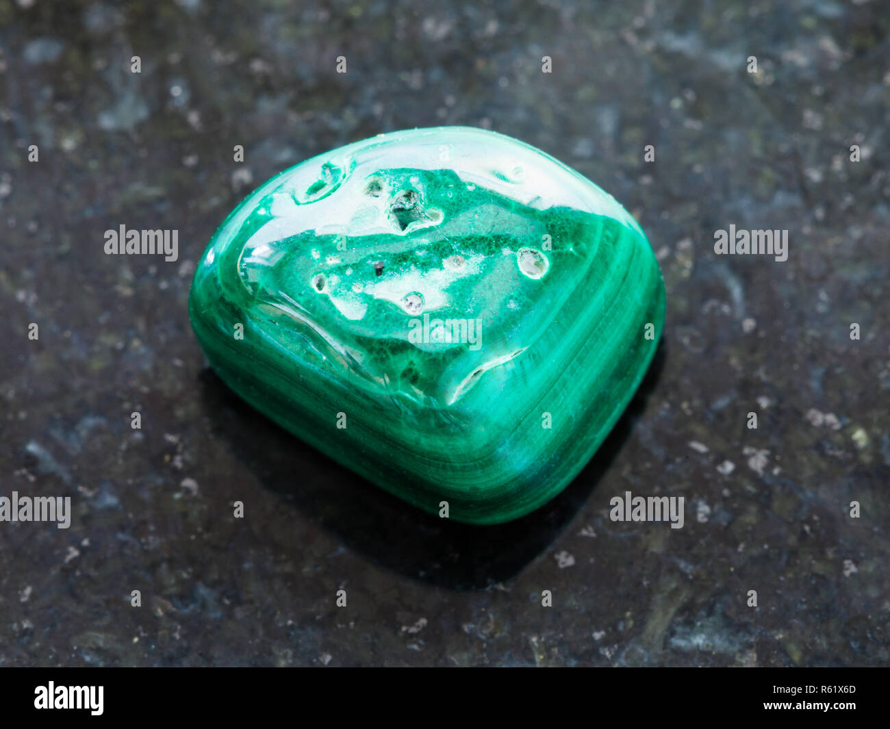 polished Malachite gemstone on dark Stock Photo Alamy