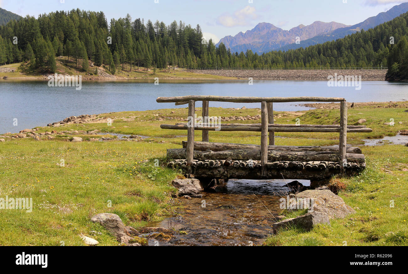 jetty at the weiÃŸbrunnsee lago fontana bianca in south tyrol Stock Photo