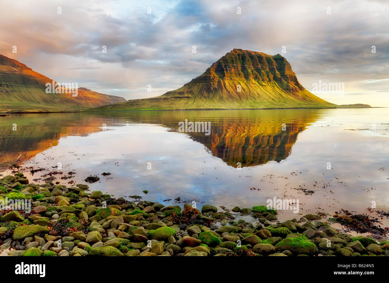 Sea coast with mountain reflection, Iceland Stock Photo