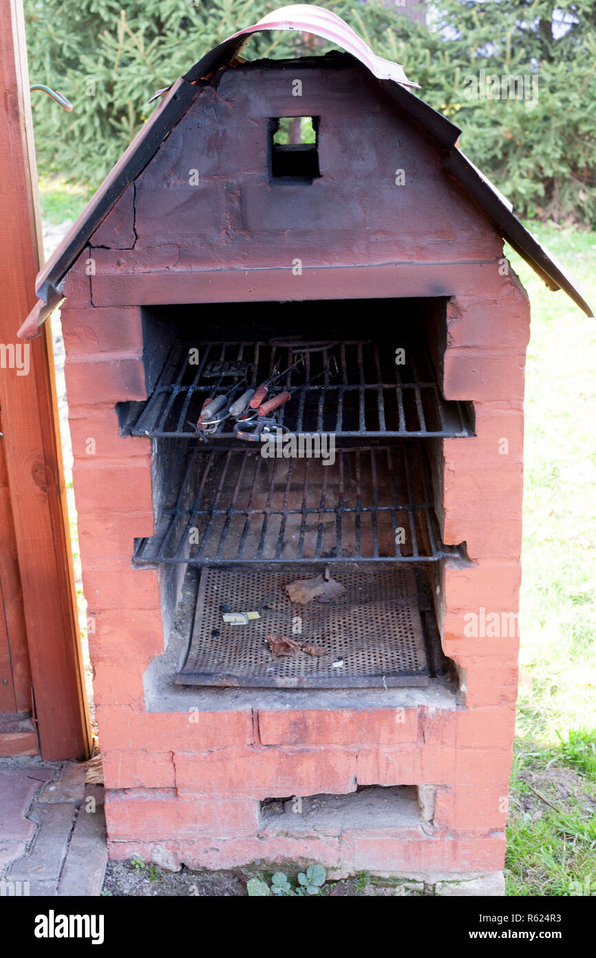 Old garden heater. grill usable for BBQ Stock Photo Alamy