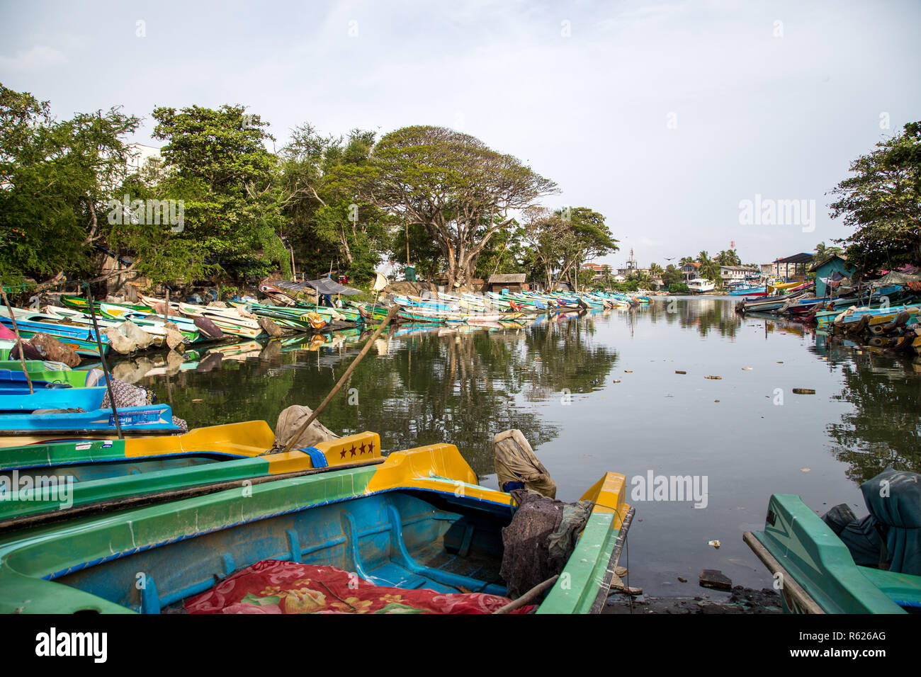 Fishing boats at the shore of Negombo Lagoon Stock Photo