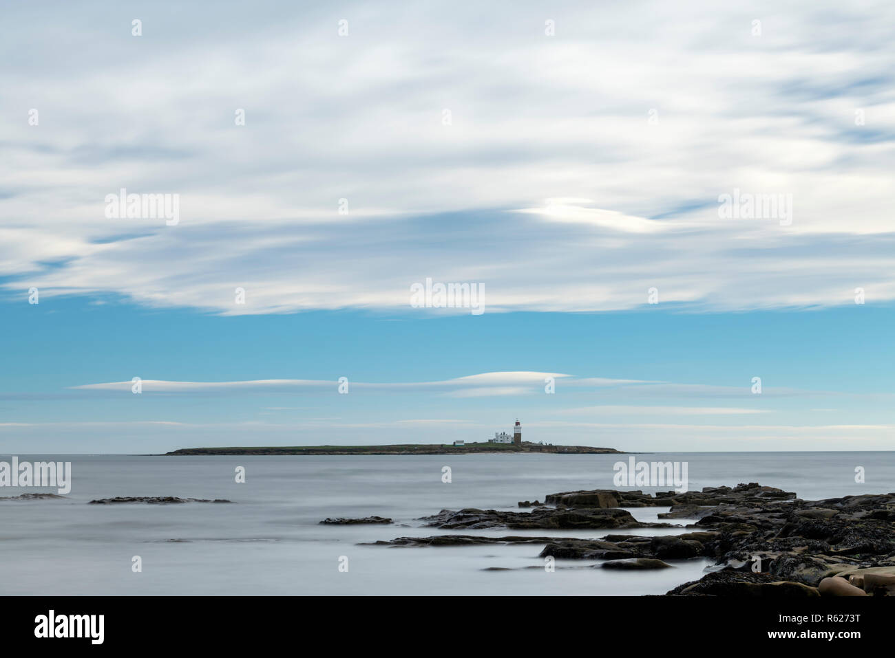 Long exposure photo of Coquet Island, off the Northumberland coast, near Amble, on a sunny summer's day, England Stock Photo