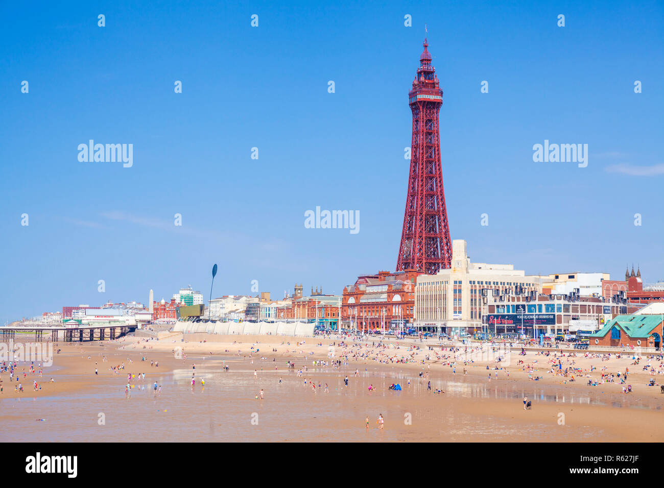 Blackpool beach summer and Blackpool tower Blackpool uk people on the sandy beach at Blackpool Lancashire England UK GB Europe Stock Photo
