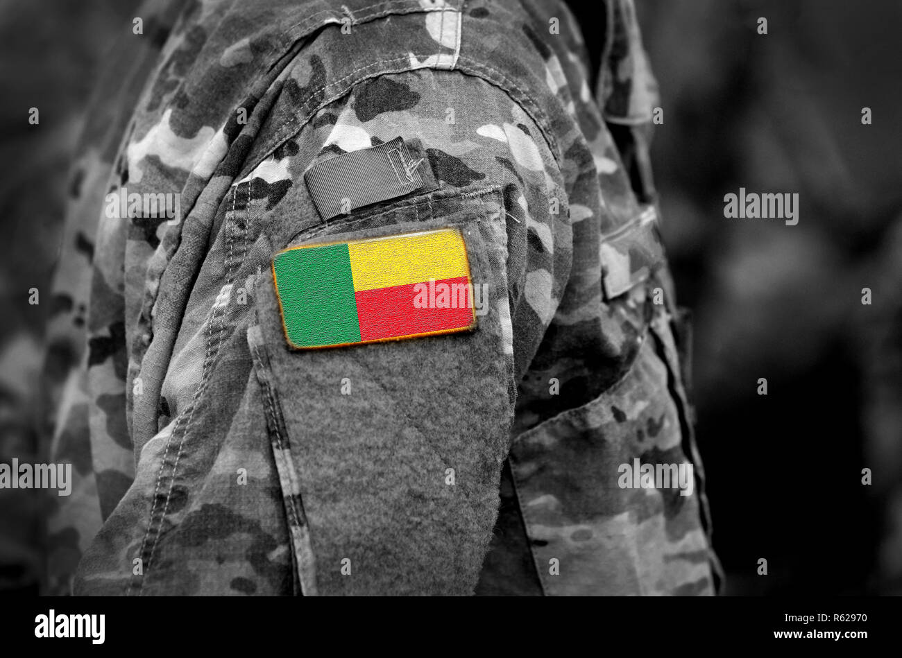 Flag of Benin on soldiers arm (collage). Stock Photo