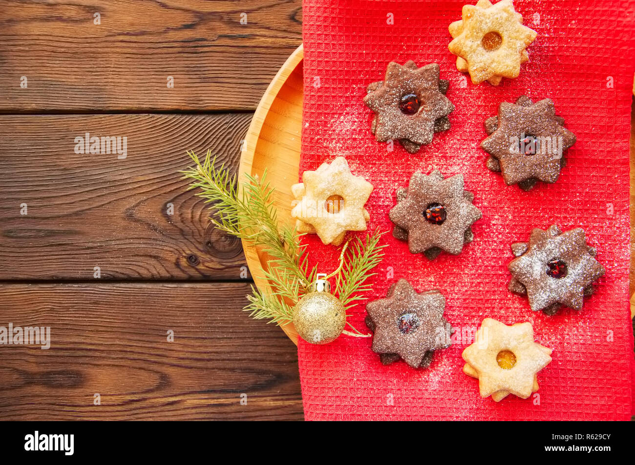 Group of chocolate and vanilla linzer cookies in a plate. Top vi Stock Photo