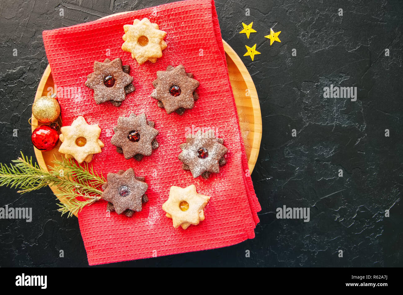 Group of chocolate and vanilla linzer cookies in a plate. Top vi Stock Photo