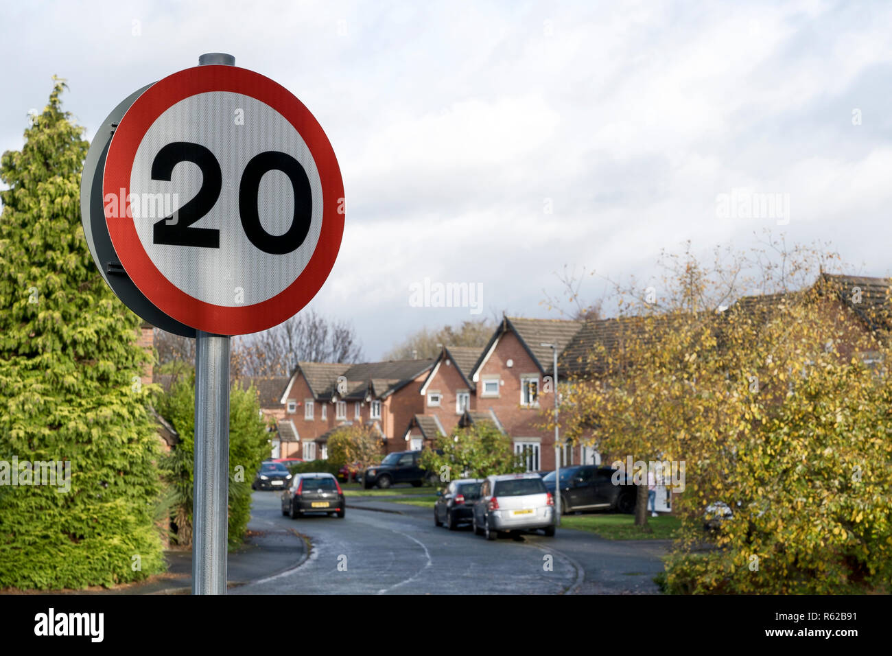 20 mph speed limit sign on the edge of a suburban street in Chester UK Stock Photo