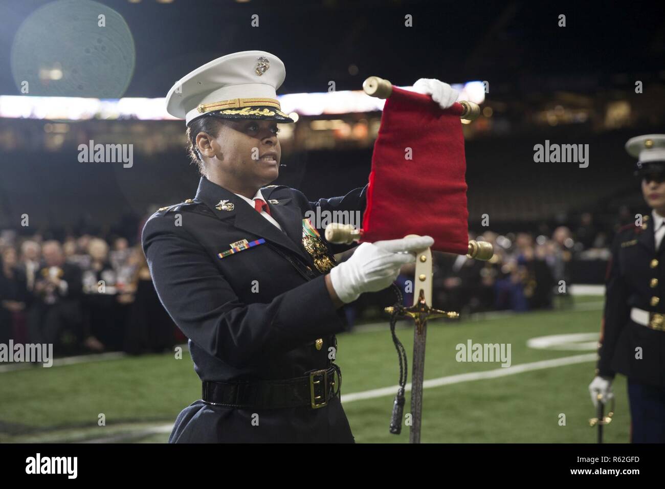 Maj. Stacey Crite, adjutant with Marine Forces Reserve, reads the 13th commandant, Maj. Gen
