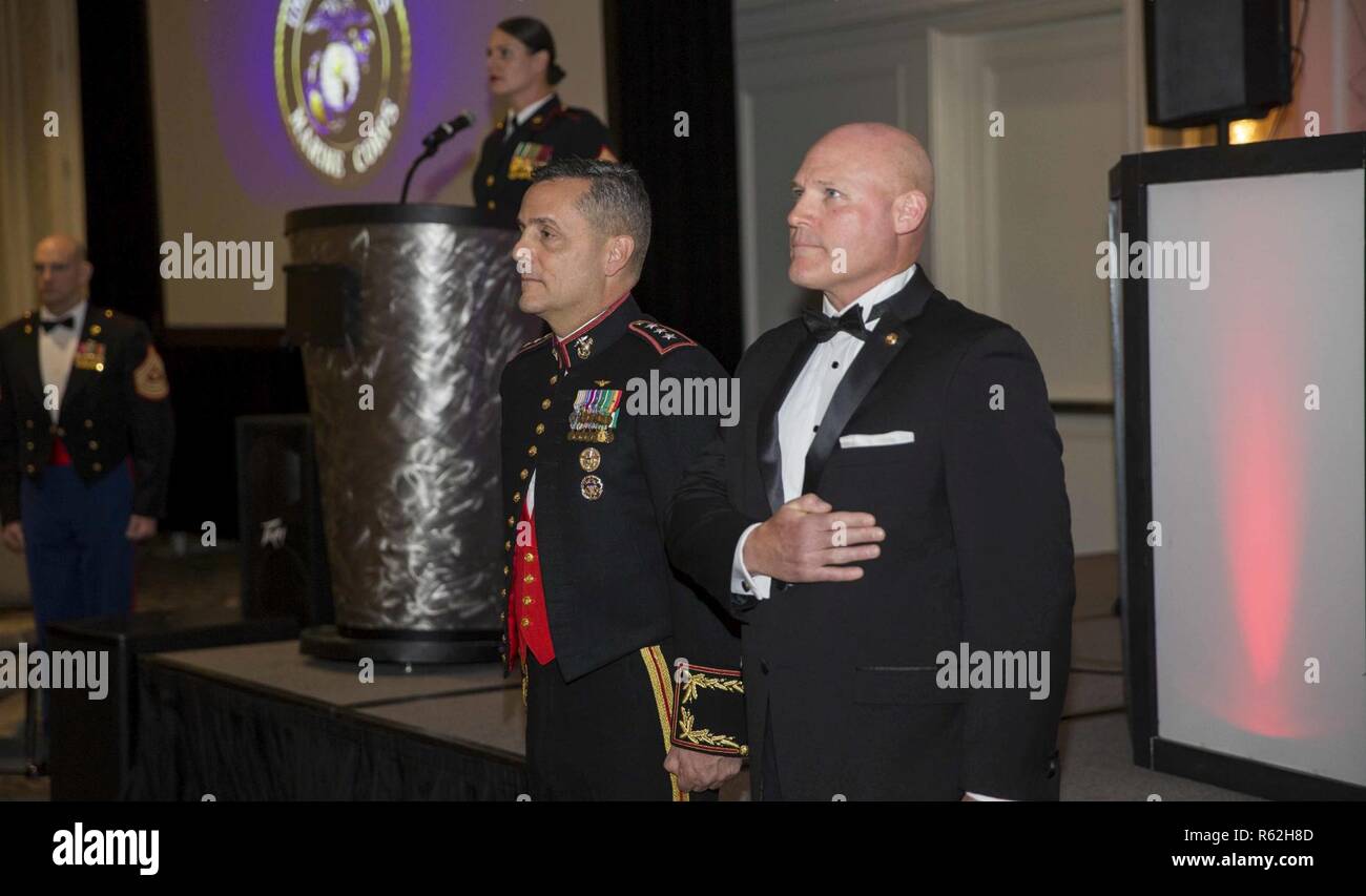 U.S. Marine Corps Lt. Gen. Michael A. Rocco, left, deputy commandant, Manpower and Reserve Affairs (M&RA), and retired Sgt. Maj. Michael P. Barrett, 17th Sergeant Major of the Marine Corps, stand for the playing of the National Anthem during the M&RA birthday ball at The Crystal Gateway Marriott, Arlington, Va., Nov. 16, 2018. Attendees celebrate the Marine Corps birthday with a colors ceremony and traditional cutting of the cake. Stock Photo
