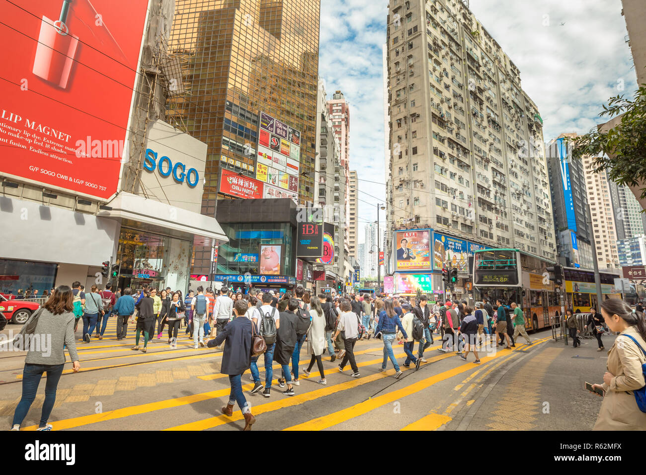 Hong Kong, China - December 6, 2016: a vast crowd at Yee Wo Street junction with Hennessy Road, Causeway Bay, the luxury shopping district, one of the busiest junctions in Hong Kong. Stock Photo