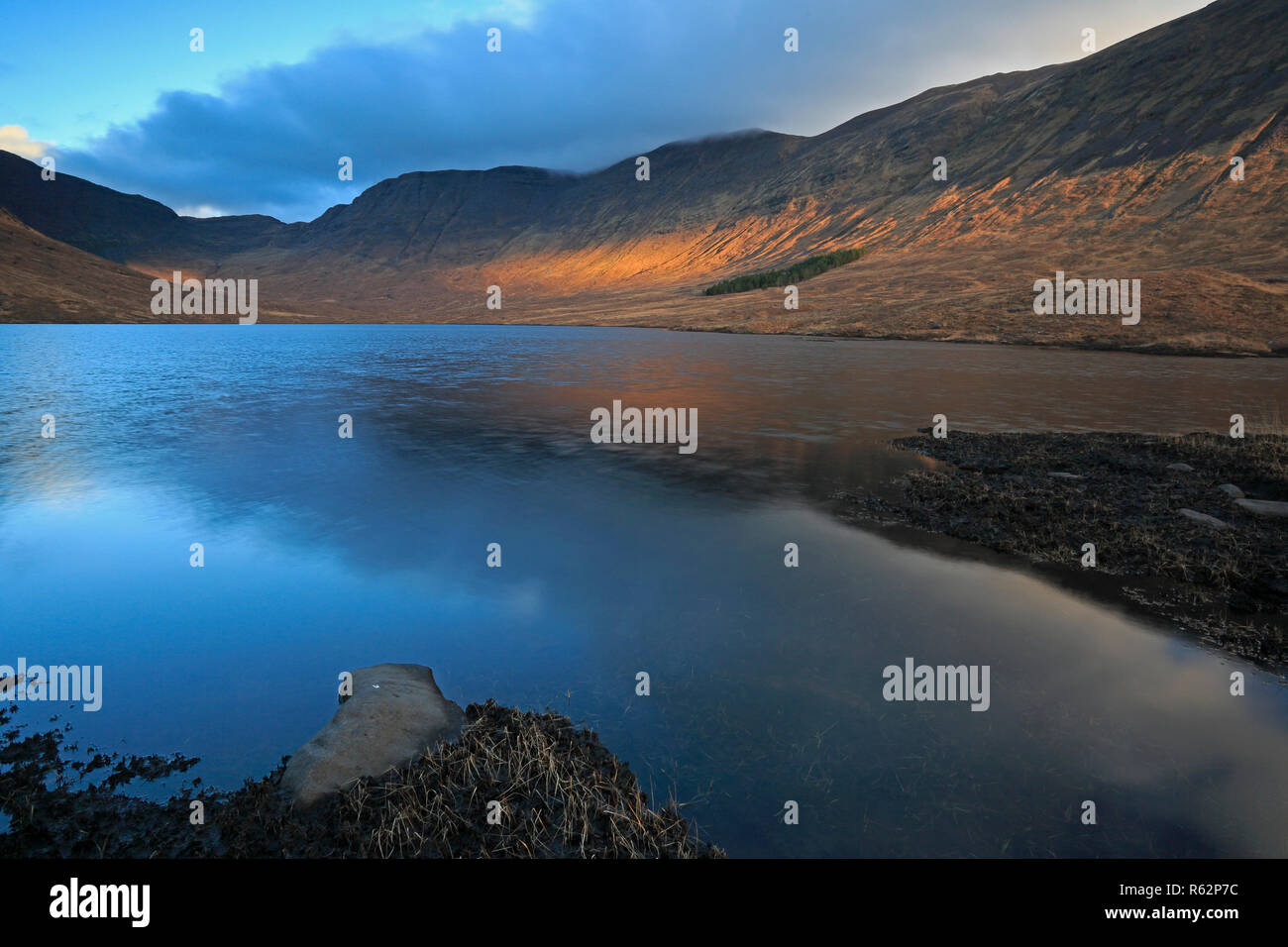 View of Loch Coire nan Arr at sunrise on the Applecross Peninsula Scotland Stock Photo