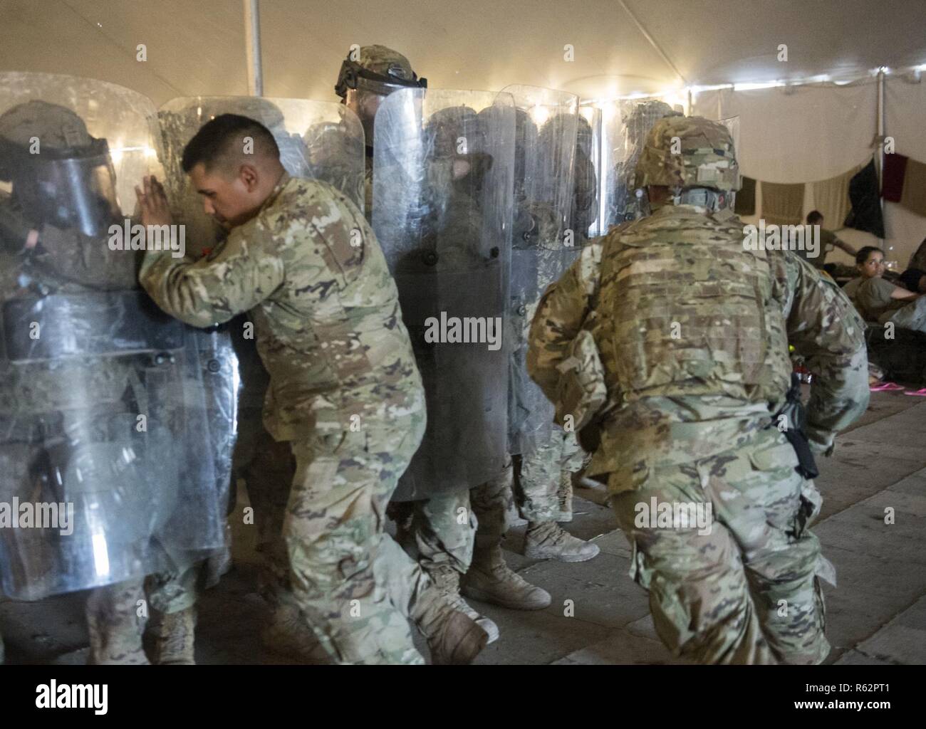 Soldiers from the 89th Military Police Brigade practice non-lethal riot  control drills at Base Camp Donna in Donna, Texas. Department of Defense  military personnel will not be conducting law enforcement functions, but
