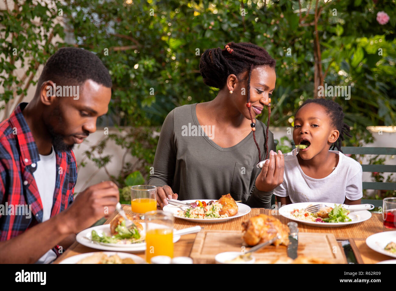 A family eating lunch together Stock Photo