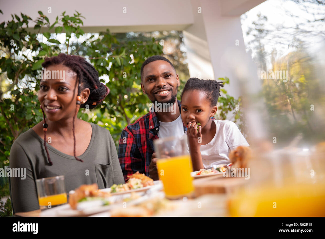 A family eating together around the table Stock Photo