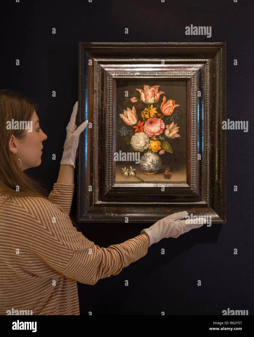 Bonhams, New Bond Street, London, UK. 3 December 2018. Bonhams Old Masters preview, image: A still life of a porcelain vase holding a floral bouquet by Ambrosius Bosschaert the Elder (1573-1621). It has been dated to 1609/10 by the leading specialist in Dutch and Flemish 17th century still-life painting, Dr Fred Meijer. It was Dr Meijer who, in 2001, first identified the painting as the work of Bosschaert the Elder. Estimate: £400,000-600,000. The sale takes place on 5th December 2018. Credit: Malcolm Park/Alamy Live News. Stock Photo