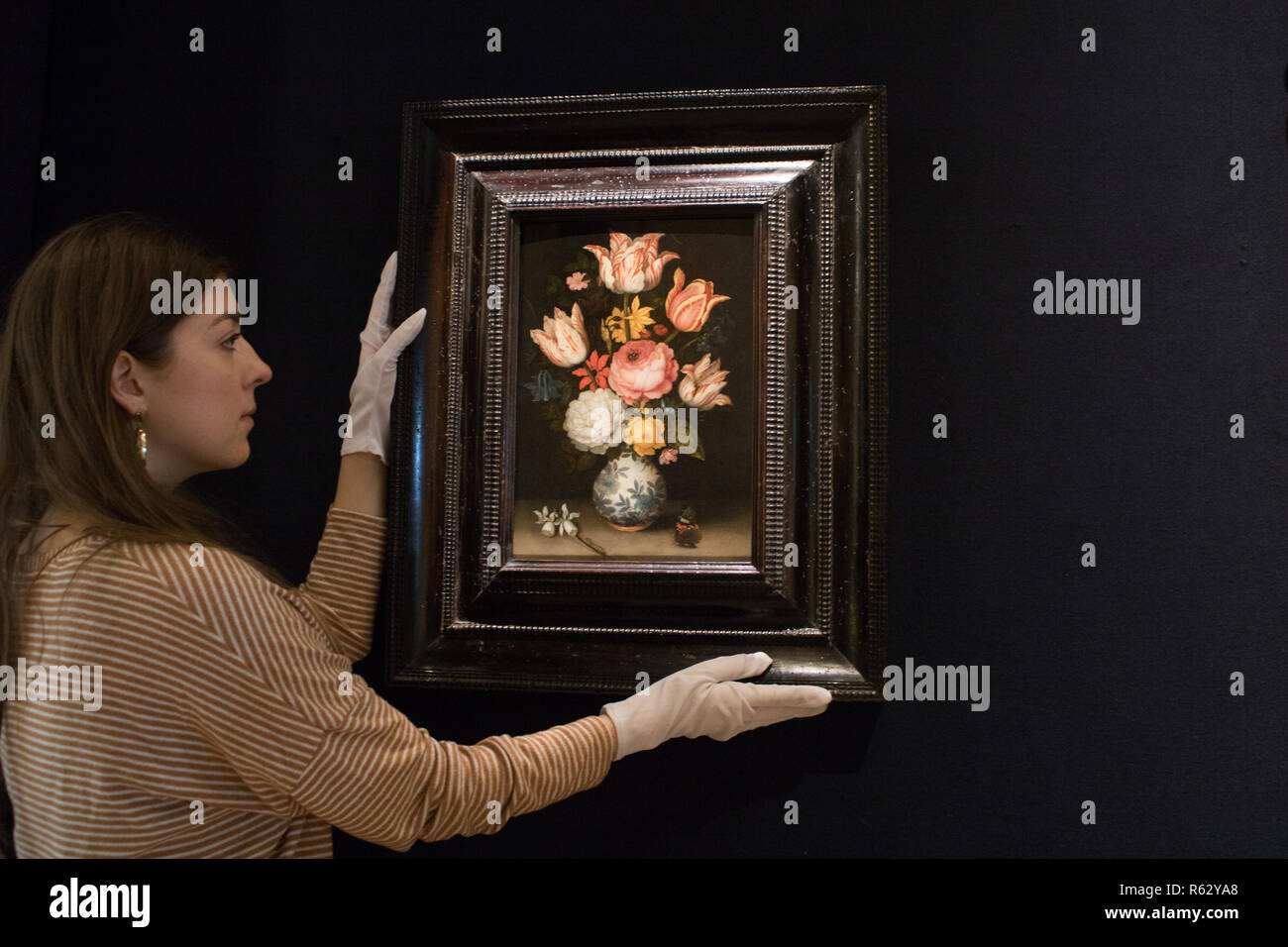 London UK. 3rd December 2018. A still life of a porcelain vase with a gilt-mounted base holding a floral bouquet including various roses, tulips, anemone,cyclamen, narcissi, hyacinth, pansy, marsh marigold and columbine. Ambrosius Bosschaert The Elder( Antwerp  1573-1621 The Hague) Press Preview at Bonhams of newly discovered Old Baroque  Master Paintings Credit: amer ghazzal/Alamy Live News Stock Photo