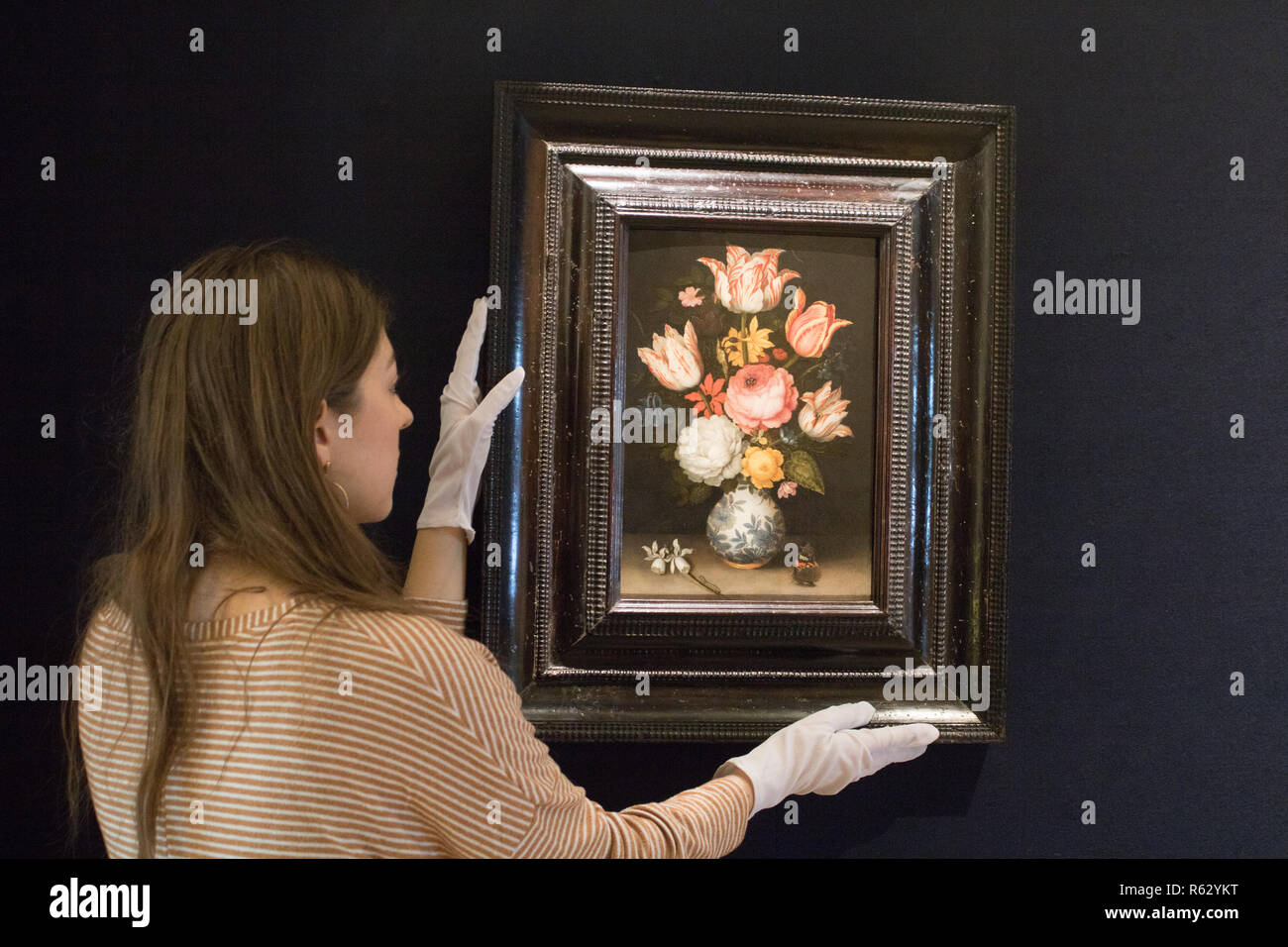 London UK. 3rd December 2018. A still life of a porcelain vase with a gilt-mounted base holding a floral bouquet including various roses, tulips, anemone,cyclamen, narcissi, hyacinth, pansy, marsh marigold and columbine. Ambrosius Bosschaert The Elder( Antwerp  1573-1621 The Hague) Press Preview at Bonhams of newly discovered Old Baroque  Master Paintings Credit: amer ghazzal/Alamy Live News Stock Photo