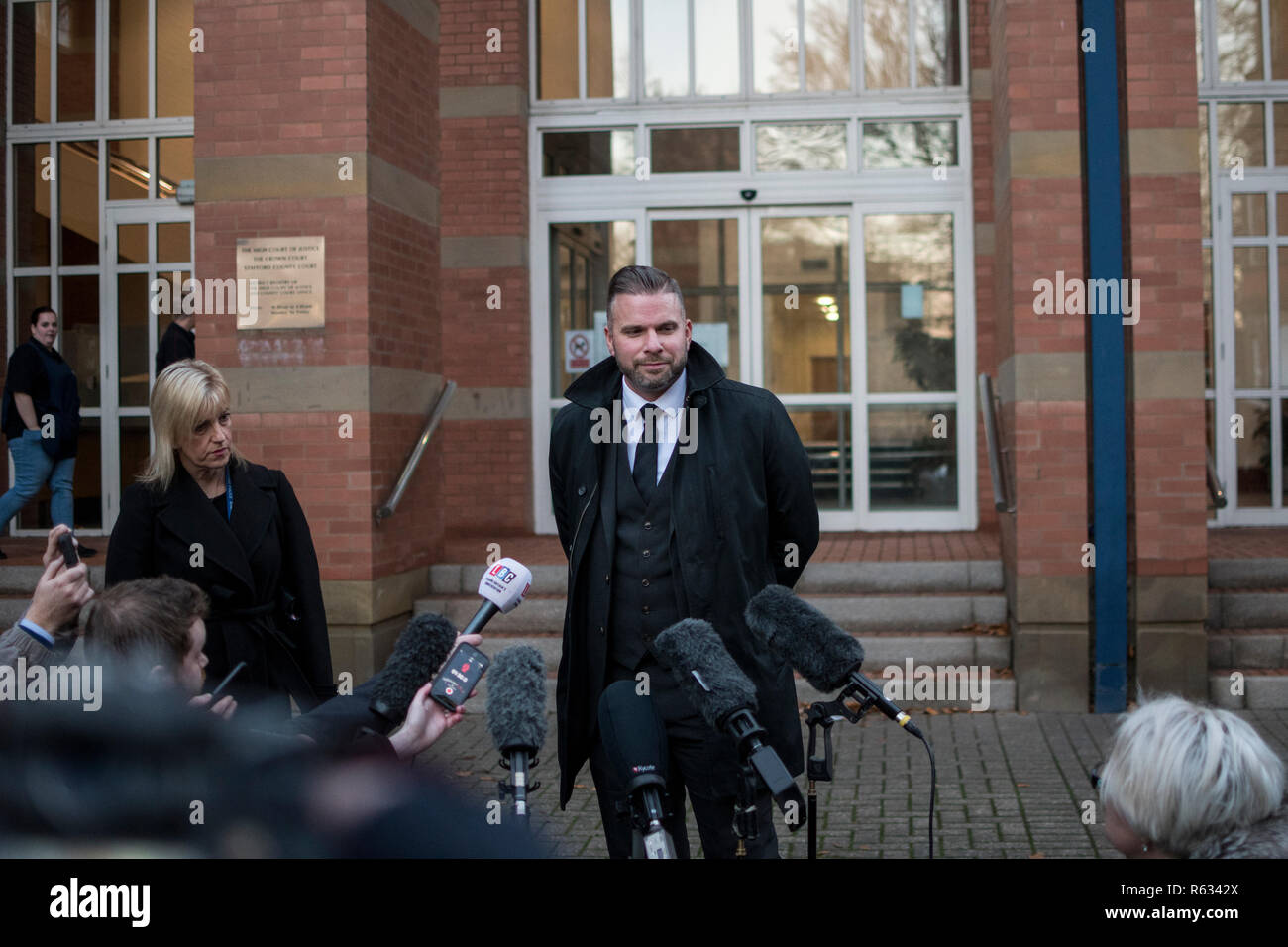 Stafford, UK. 3 December 2018. Gemma Eastwood, the sister of murdered midwife Samantha Eastwood, and Detective Inspector Dan Ison speak to media outside Stafford Crown Court. Michael Stirling was sentenced to life in prison for the murder last July. Credit: Benjamin Wareing/ Alamy Live News Stock Photo