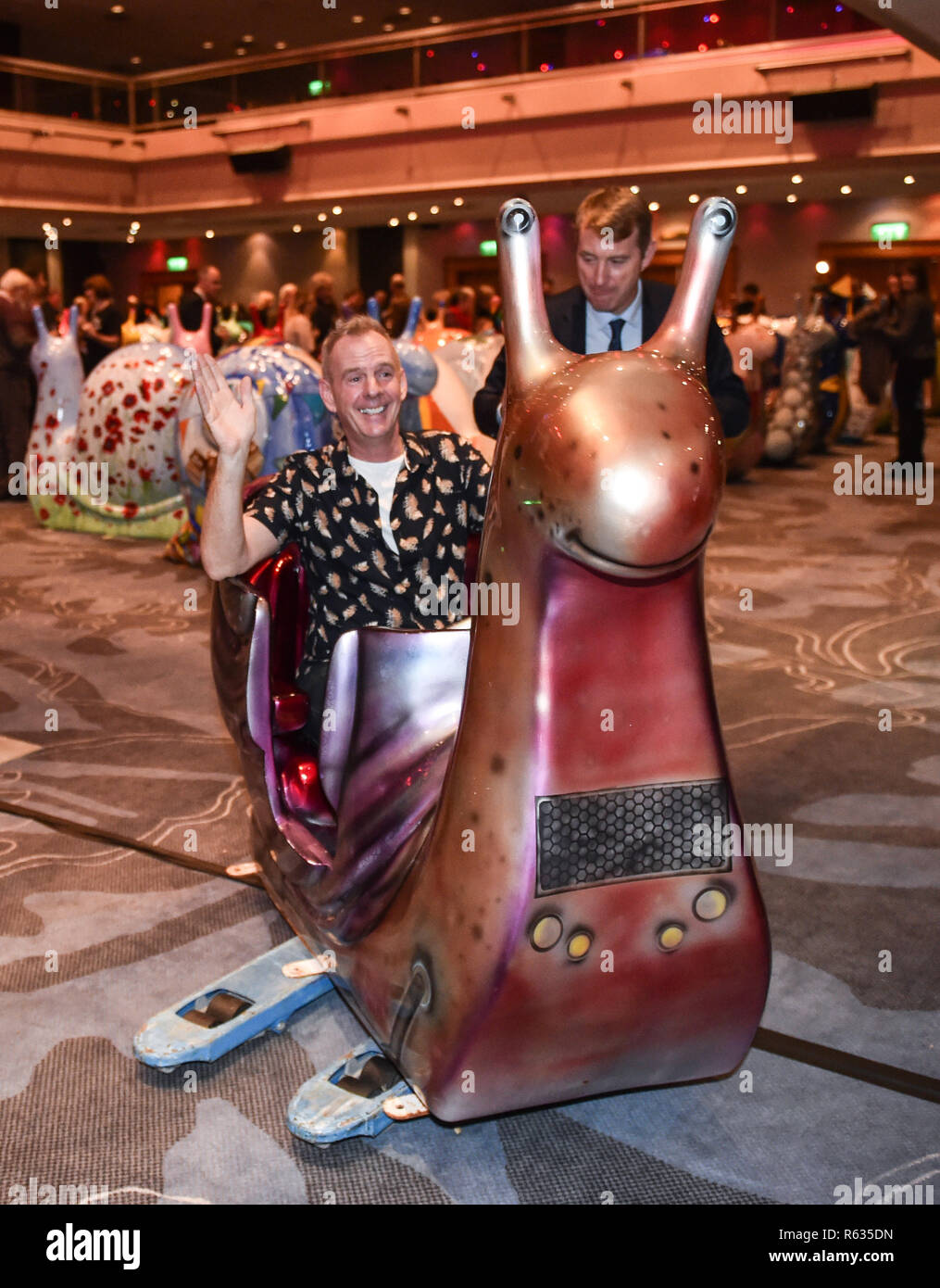Brighton UK 3rd December 2018 -Norman Cook aka Fat Boy Slim at the auction for the Snailspace snail sculptures held in the Hilton Metropole Hotel Brighton tonight . The snails have been on display around the city since September and the money raised from the auction will go towards the local Martlets Hospice . Credit: Simon Dack/Alamy Live News Stock Photo