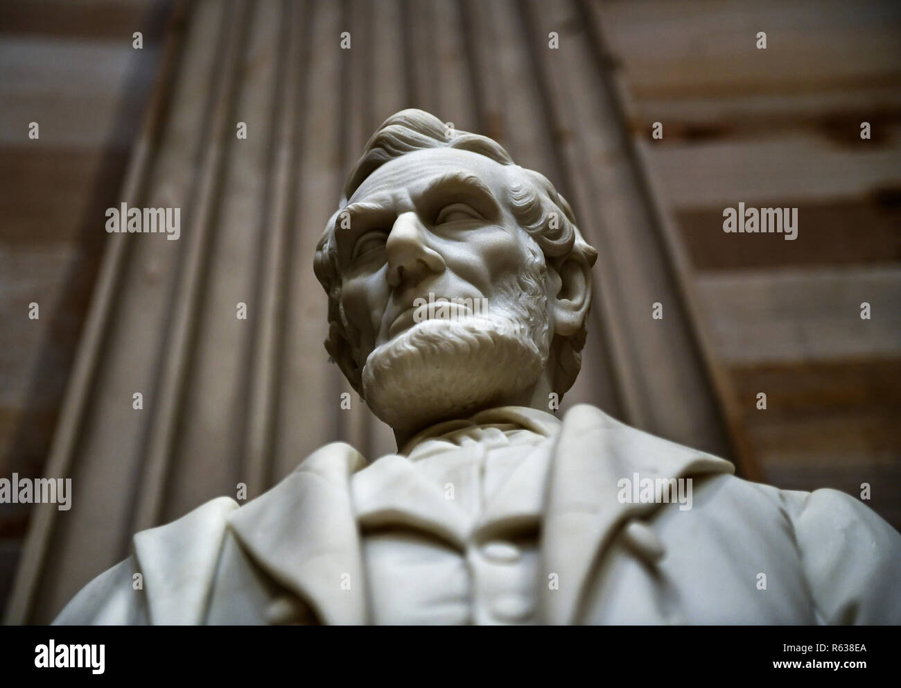 A statue of Abraham Lincoln, the 16th President of the United States, stands inside the Rotunda of the US Capitol, December 3, 2018 in Washington, DC. - The body of the late former President George H.W. Bush will travel from Houston to Washington, where he will lie in state at the US Capitol through Wednesday morning. Bush, who died on November 30, will return to Houston for his funeral on Thursday. (Photo by Brendan Smialowski/AFP)/POOL PHOTO | usage worldwide Stock Photo