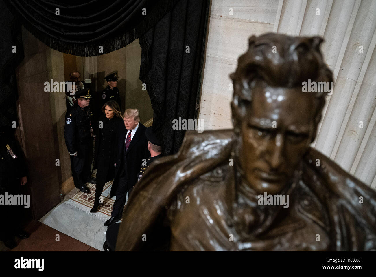 Washington, DC. 03rd Dec, 2018. WASHINGTON, DC - DECEMBER 3 : President Donald J. Trump and first lady Melania Trump walk by a statue of former President Andrew Jackson as they arrive to pay their respects to former president George H.W. Bush as he lies in State at the U.S. Capitol Rotunda on Capitol Hill on Monday, Dec. 03, 2018 in Washington, DC. (Photo by Jabin Botsford/Pool) | usage worldwide Credit: dpa/Alamy Live News Stock Photo