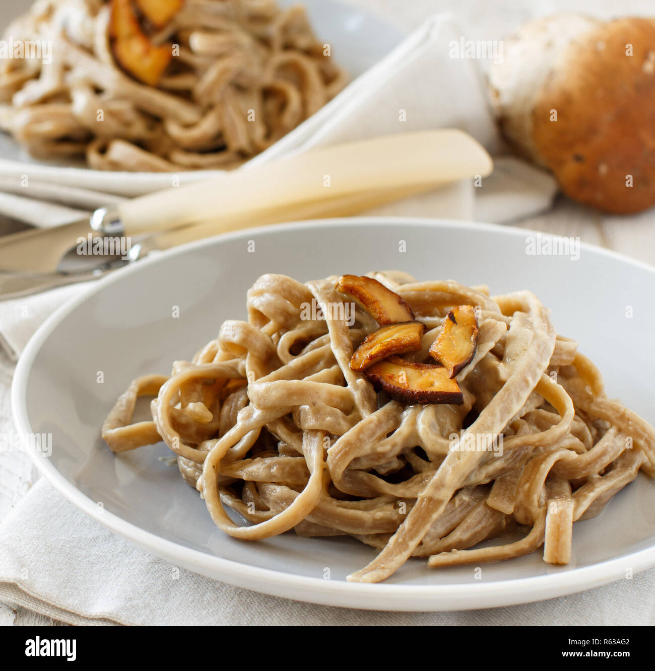 Whole wheat tagliolini with mushrooms Porcini Stock Photo Alamy