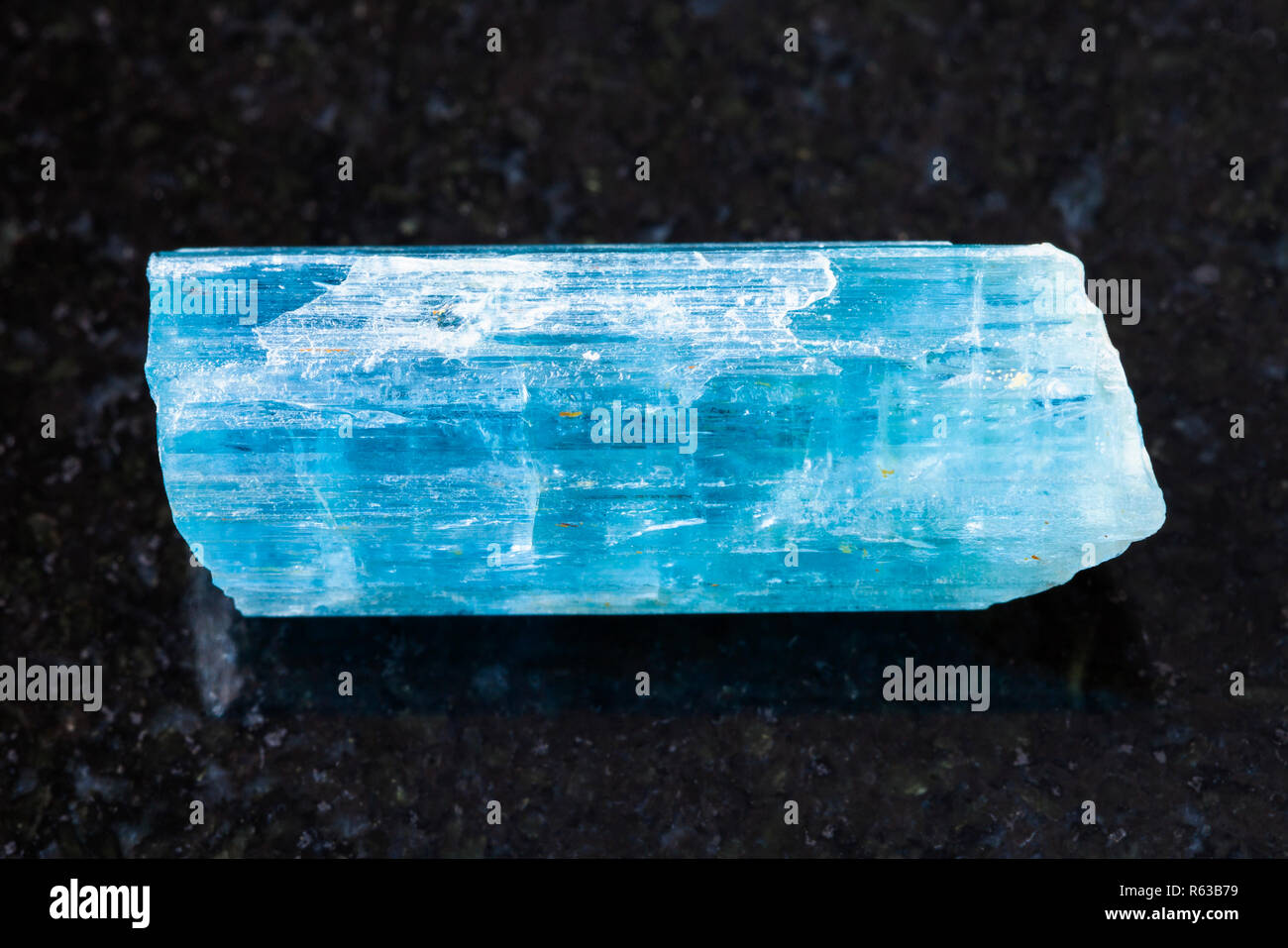 crystal of aquamarine (blue beryl) gem on dark Stock Photo - Alamy