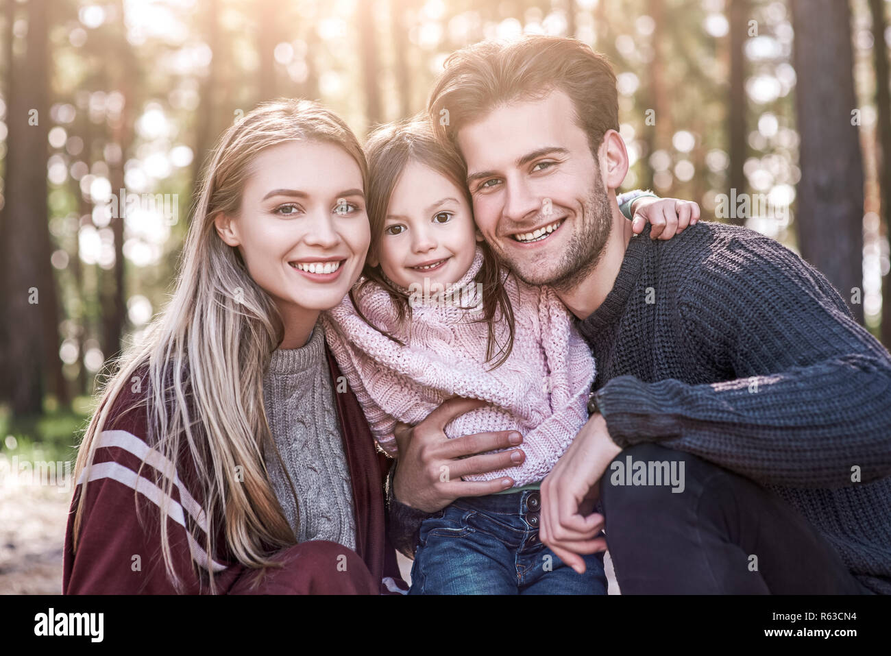 Close-up family portrait in forest, natural background Stock Photo