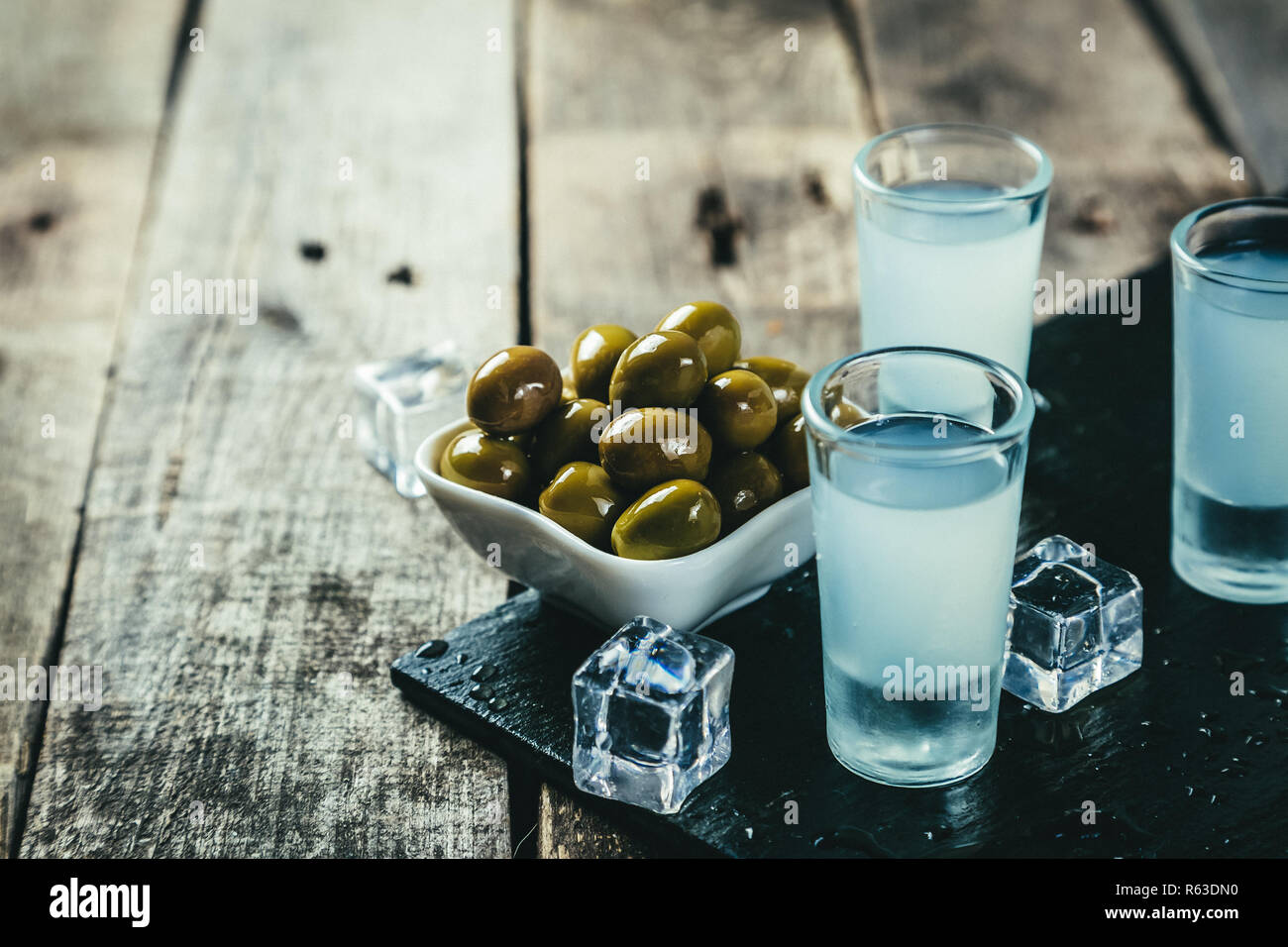 Traditional greek vodka - ouzo in shot glasses Stock Photo