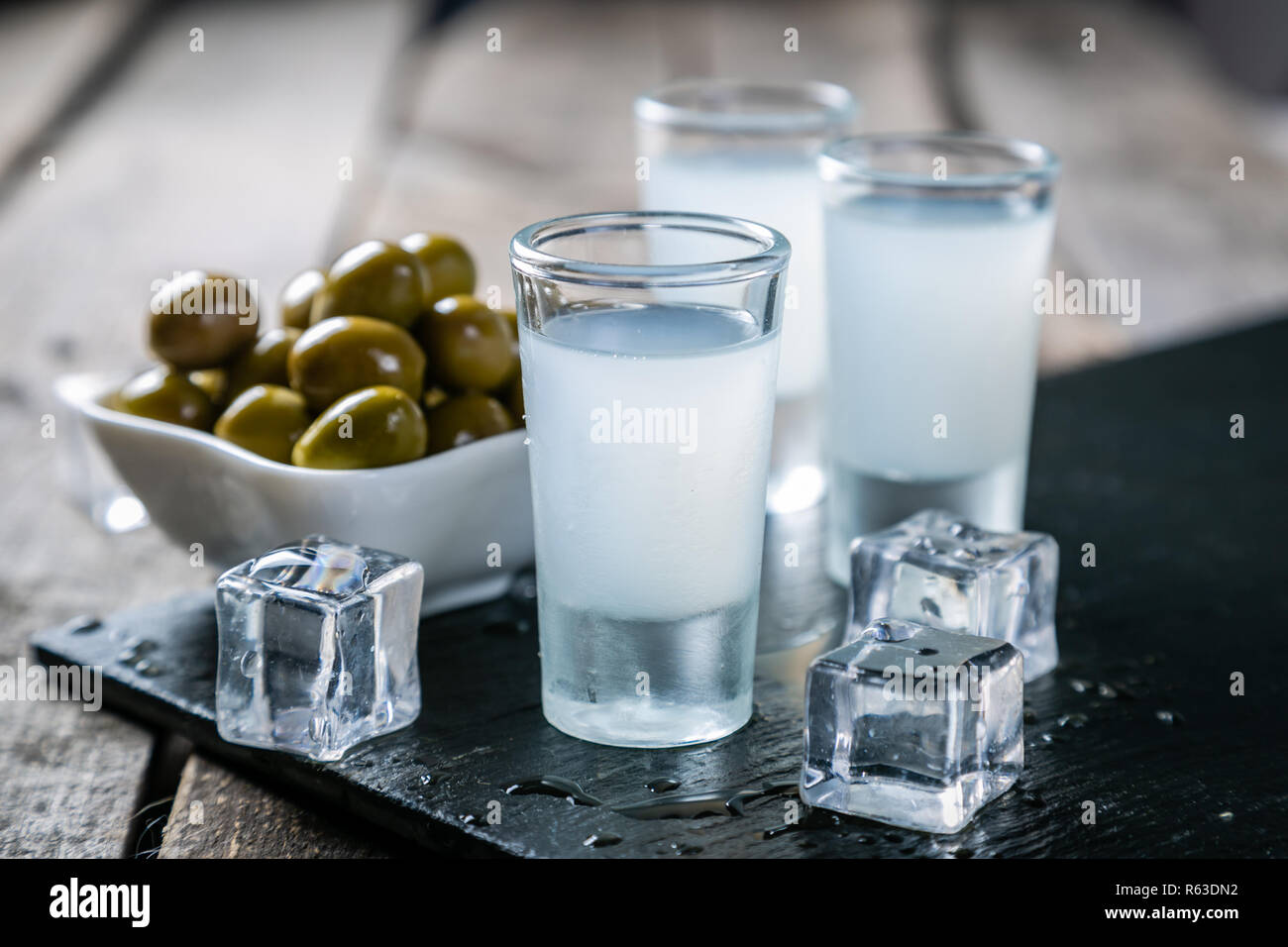 Traditional greek vodka - ouzo in shot glasses Stock Photo