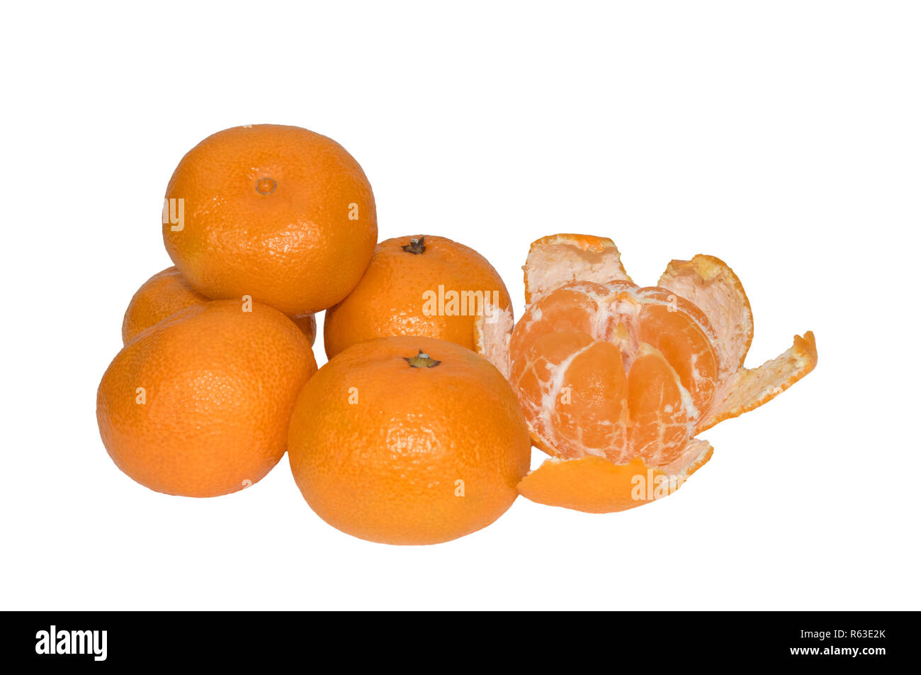 image of whole tangerines and one peeled on white background Stock