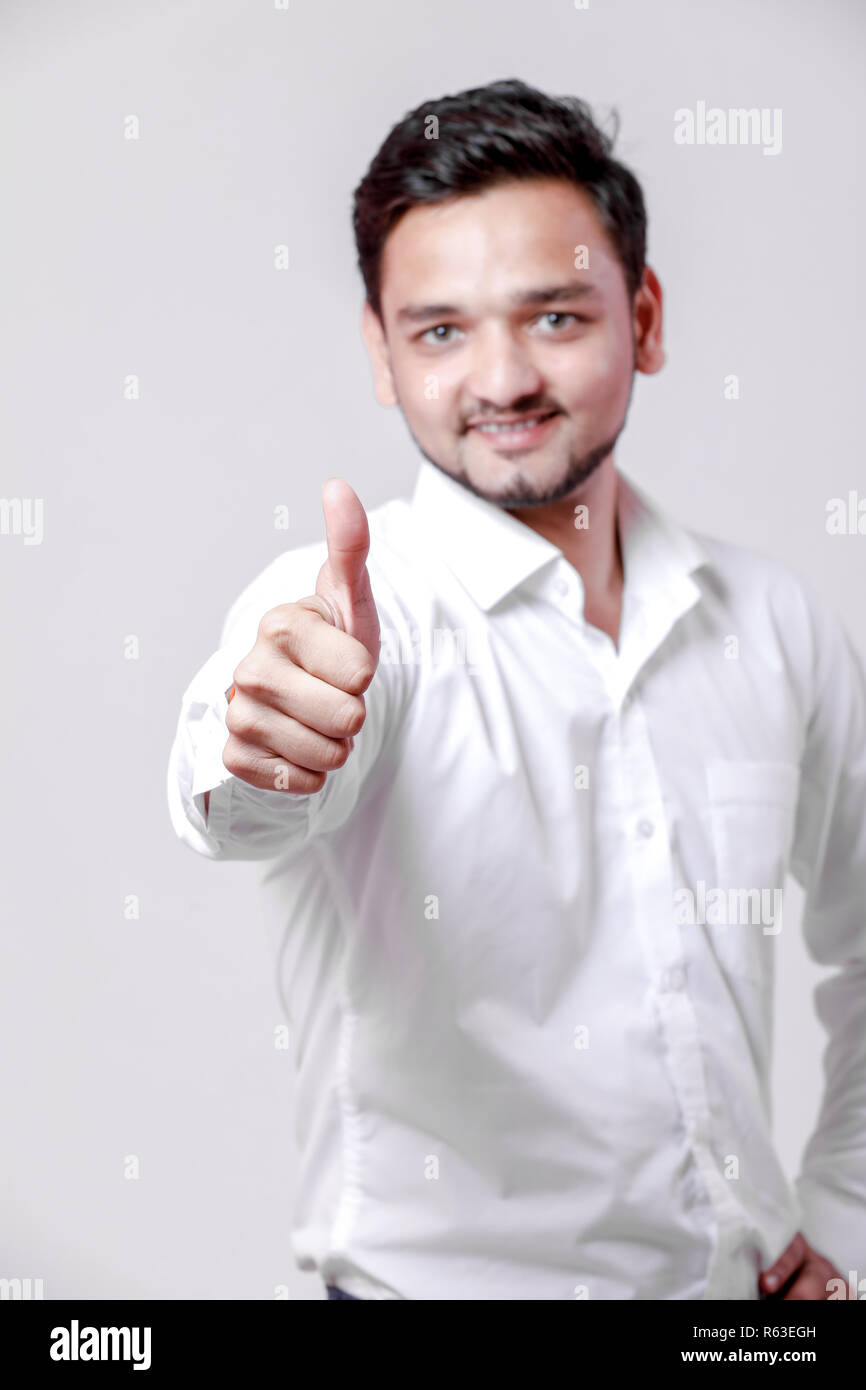 Young indian man showing thump up Stock Photo