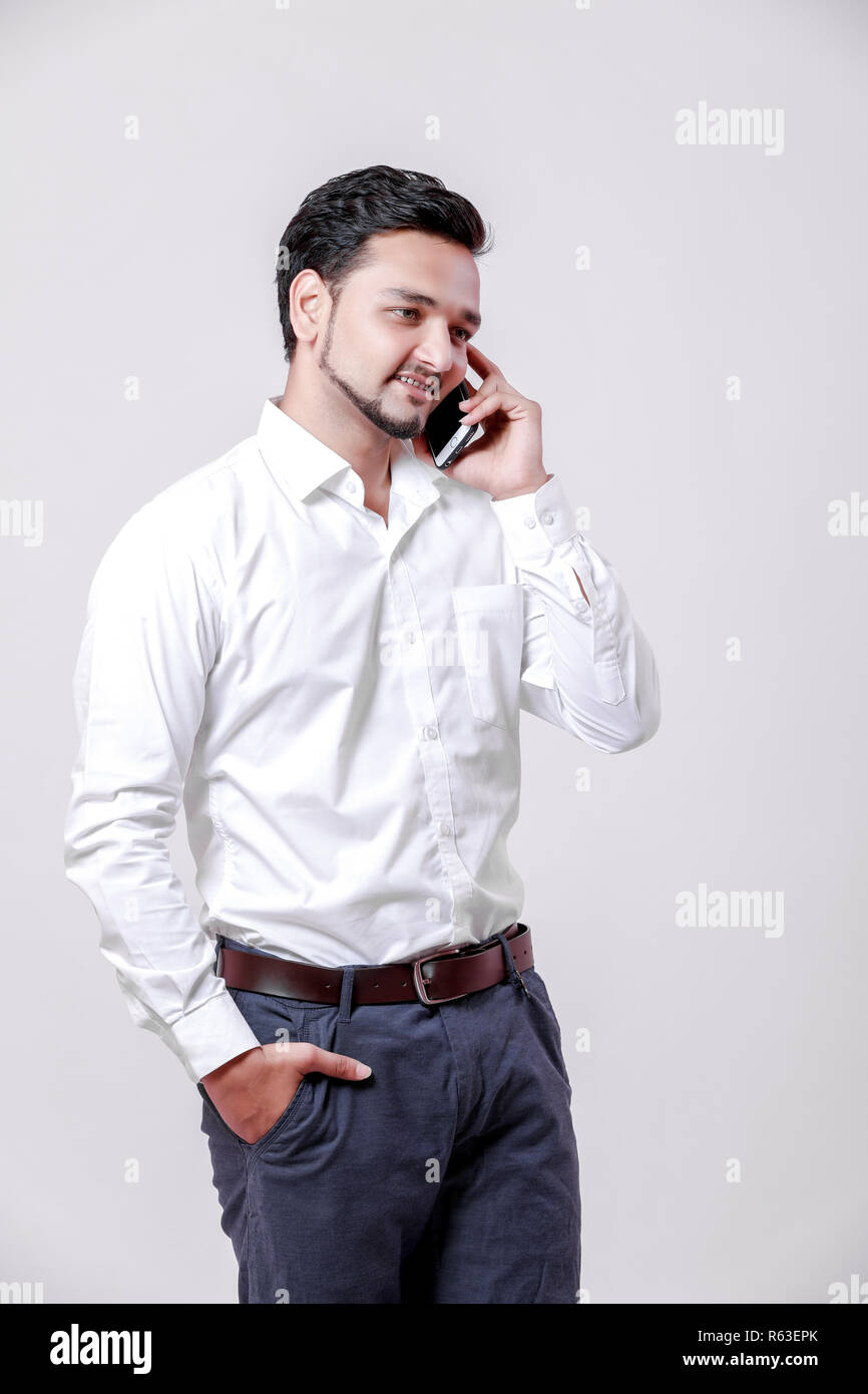 Young indian man using mobile Stock Photo