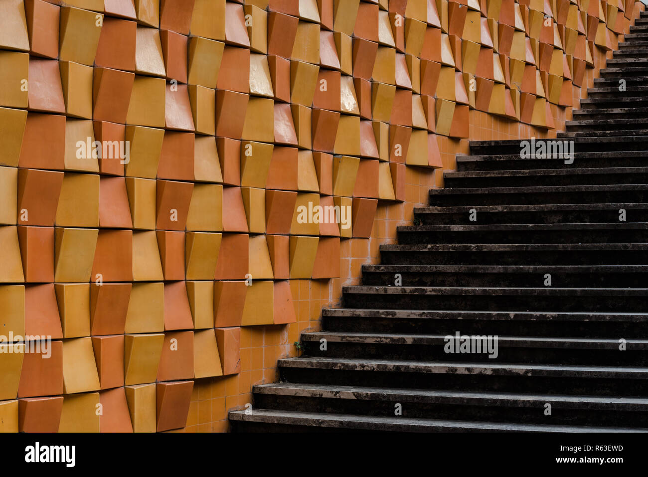 Decorative bricks on wall along exterior stairs in city Stock Photo Alamy