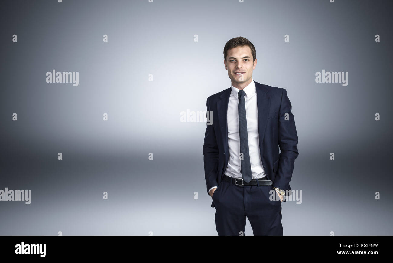 confident businessman with hands in pocket studio shot Stock Photo