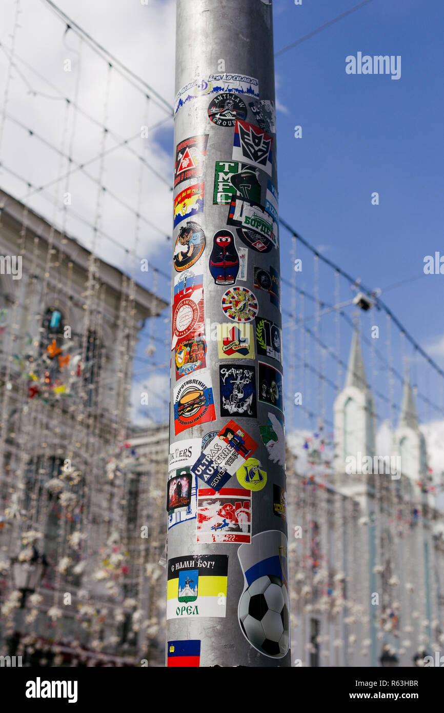 Moscow/Russia - July 1 2018: Lamp post in the center of Moscow on Nikolskaya Street covered with football fans stickers Stock Photo