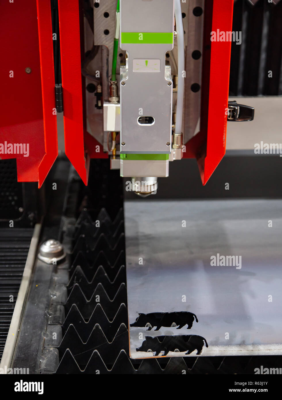 CNC laser cutting machine cutting metal sheet Stock Photo Alamy