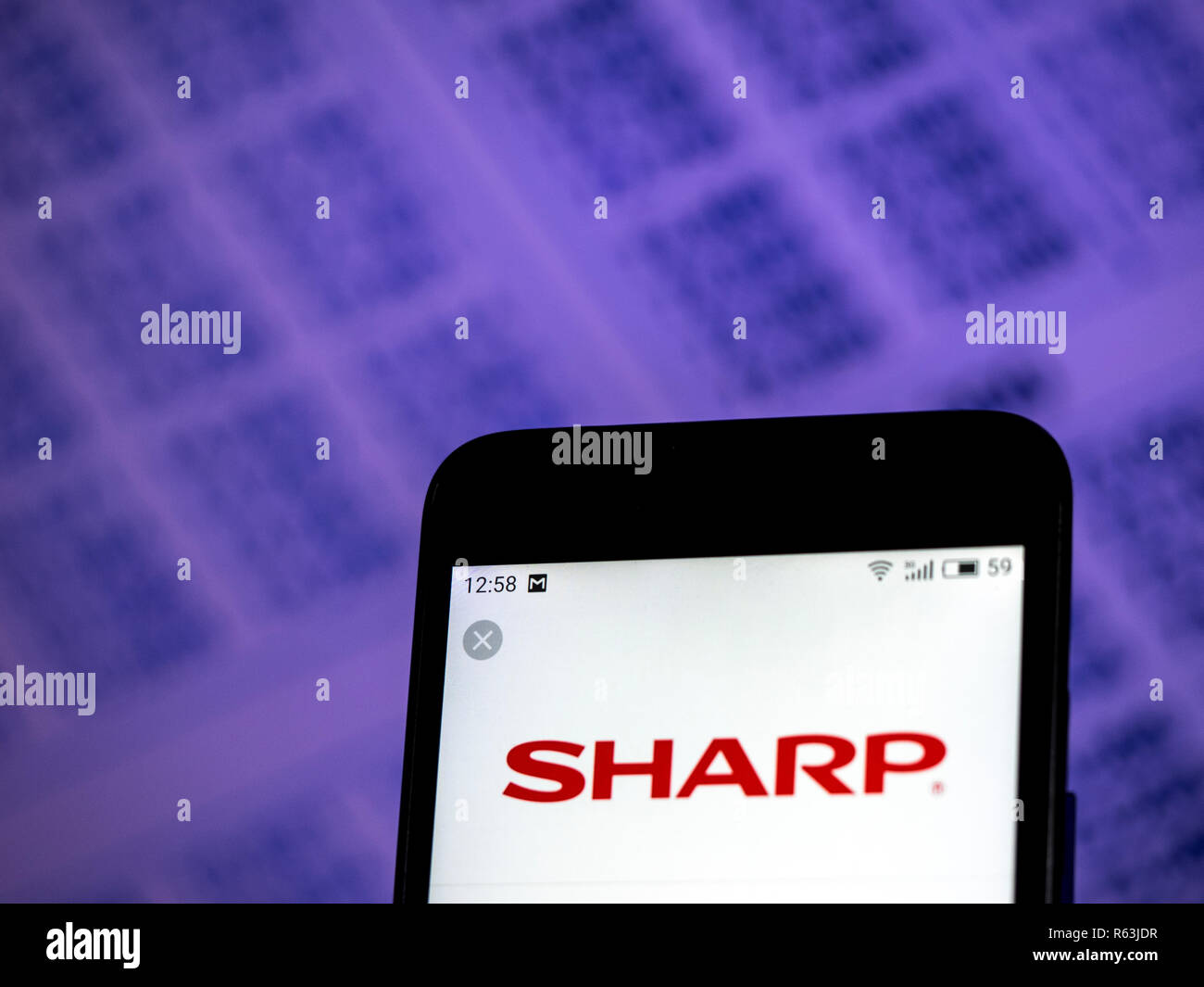 Sharp Corporation logo seen displayed on smart phone. Stock Photo