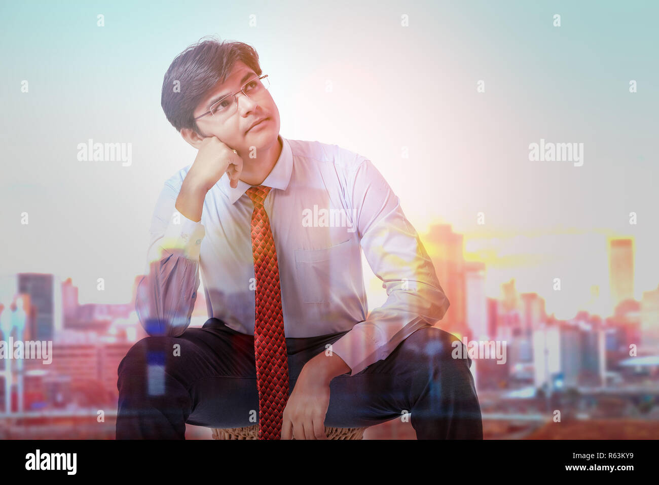 Young Indian business man thinking Stock Photo