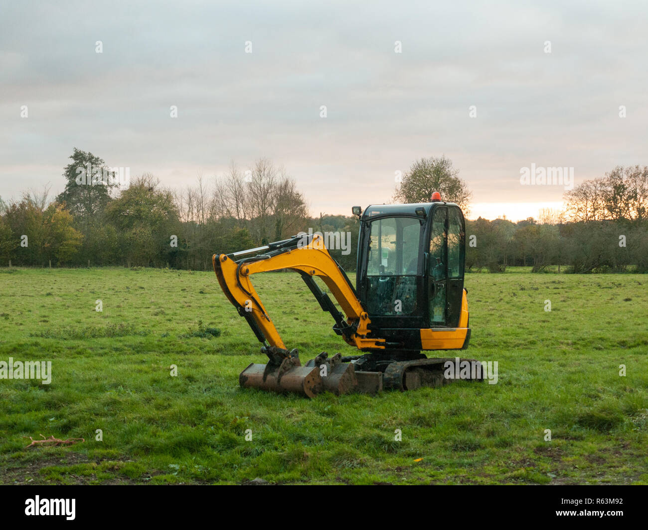 industry construction environment yellow digger machine parked o Stock Photo