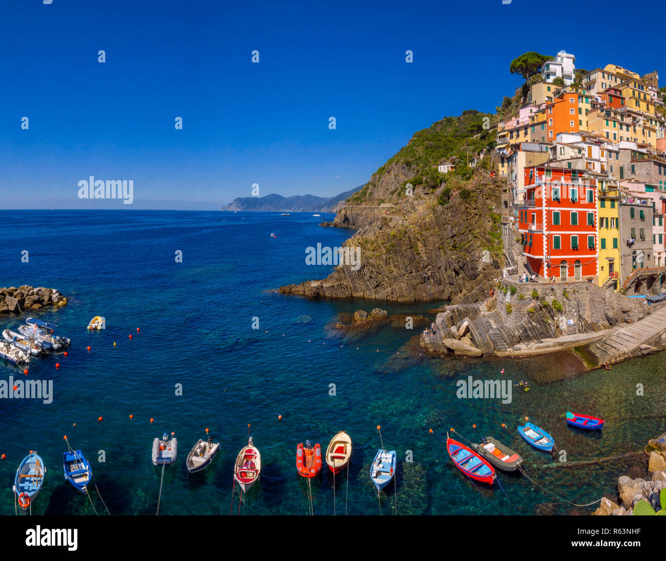 Town view with harbor and colorful houses, Riomaggiore, Cinque Terre, La Spezia, Liguria, Italy, Europe Stock Photo