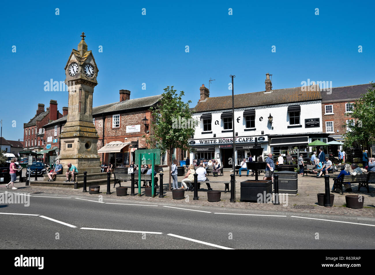 White Horse Cafe and shops stores in the town centre in summer Market