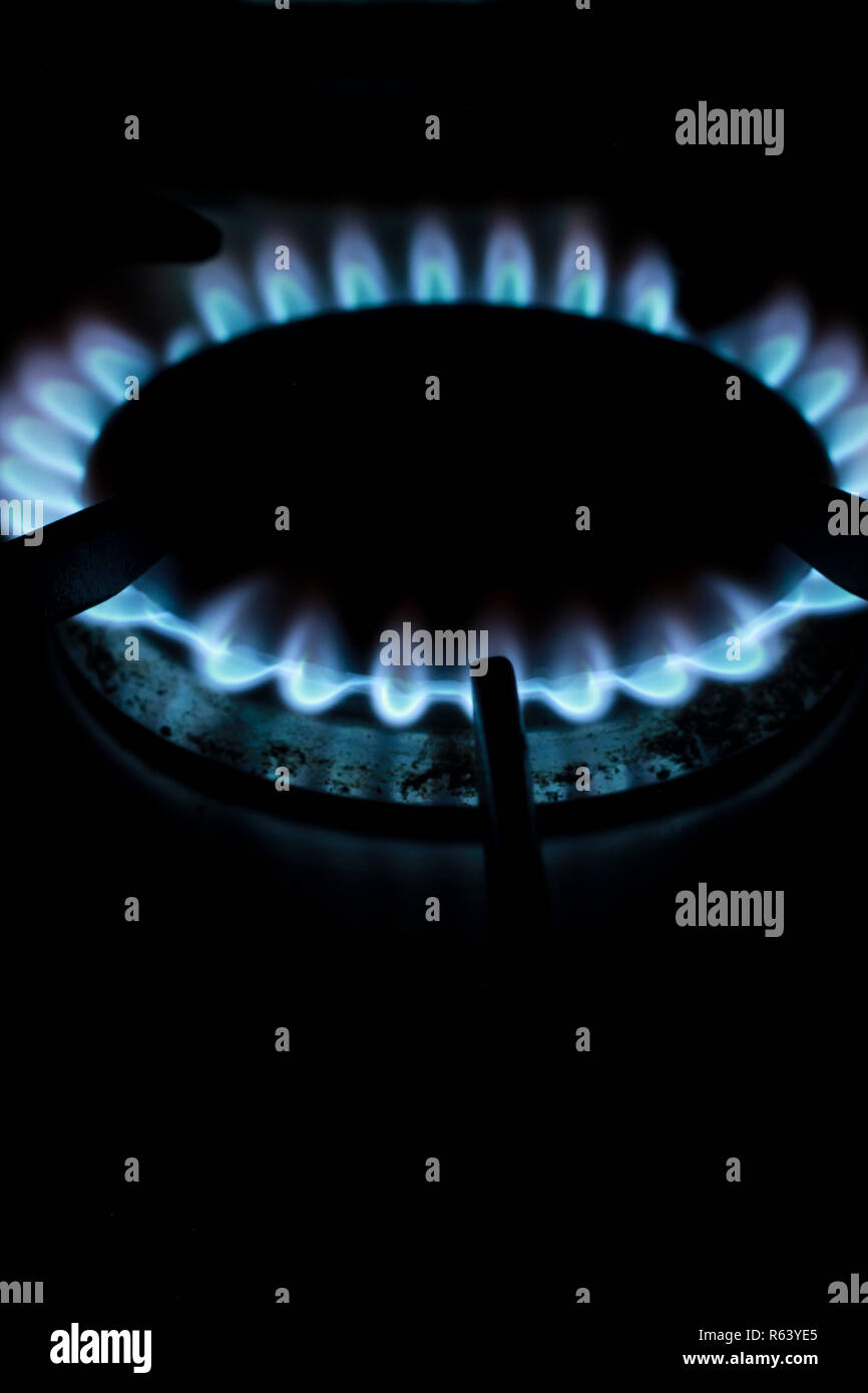 Blue flames on a gas hob Stock Photo Alamy