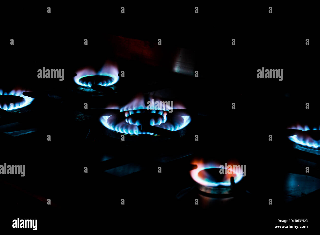 Blue flames on a gas hob Stock Photo Alamy