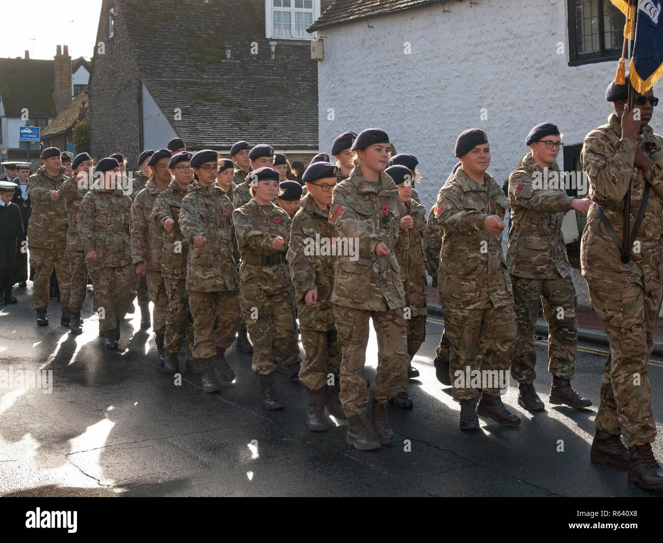 Members of the Army Cadet Force march through the village of Rottingdean on Remembrance Day Stock Photo