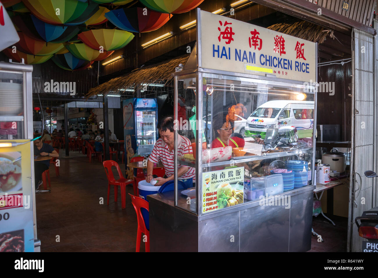Penang, Malaysia – December 2016: Chinese street food restaurant vendor in Georgetown, Penang, Malaysia. Georgetown is famous for its street food cult Stock Photo