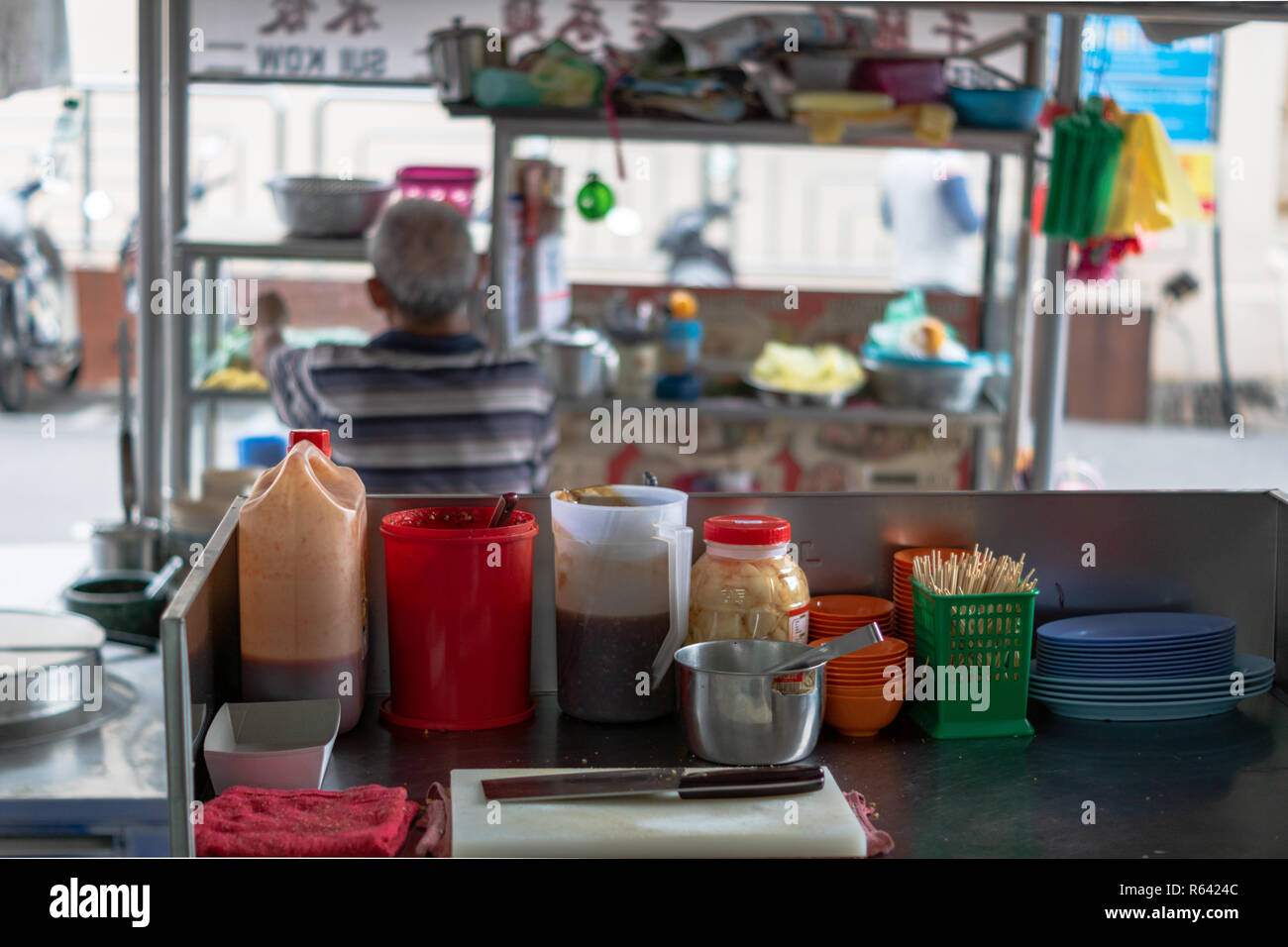 Penang, Malaysia - December 2016: Street food restaurant kitchen in Georgetown, Penang, Malaysia. Georgetown is famous for its street food culture. Stock Photo